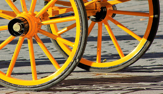 yellow and black carriage on gray floor