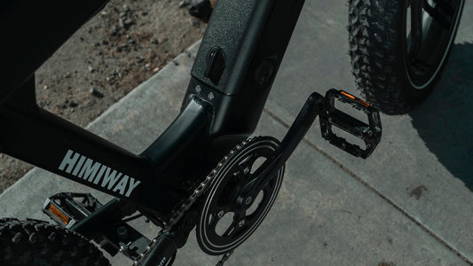 black bicycle on brown soil
