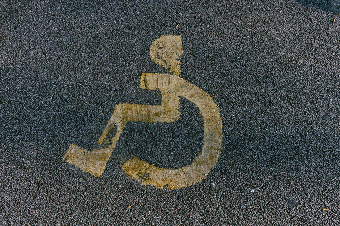a handicapped sign is painted on the pavement