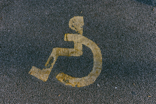 a handicapped sign is painted on the pavement