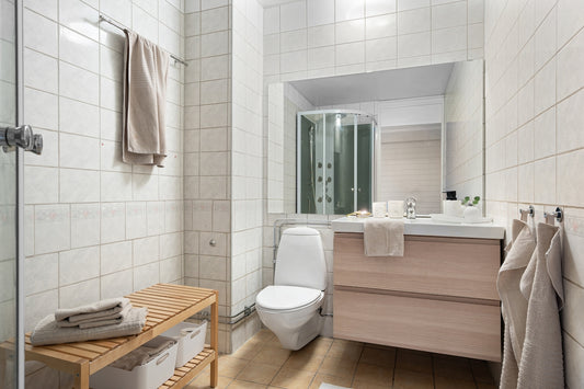 A bathroom with a sink, toilet, and shower