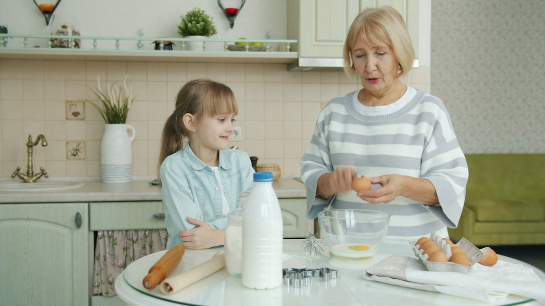 Grandmother and granddaughter baking together in kitchen