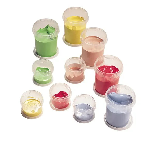 Set of open plastic containers with colorful thick paints in green, yellow, pink, red, and blue on white background