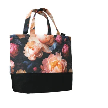 Black tote bag with large pink and peach floral print and sturdy handles