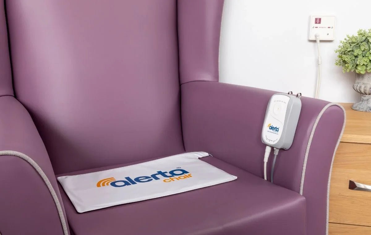 Alerta chair sensor alarm for elderly on a purple armchair, enhancing safety and fall prevention