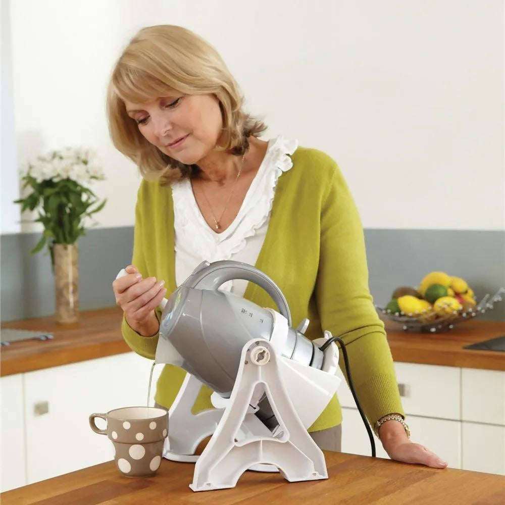 Homecraft kettle tipper for disabled users, allowing easy pouring with one hand in kitchen settings
